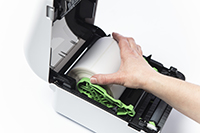 placing label roll in to a TD-4D label printer with cover open