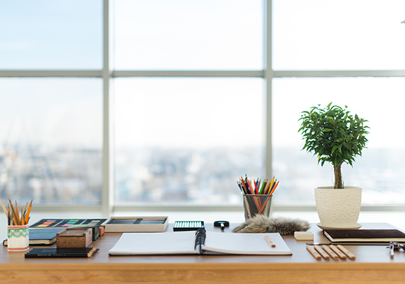 image of a desk with open notepad