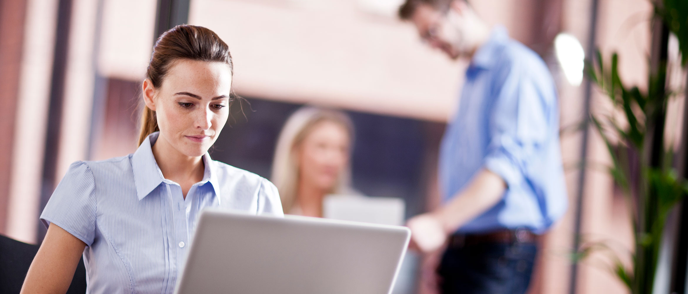 Woman working on laptop finding Brother dealer