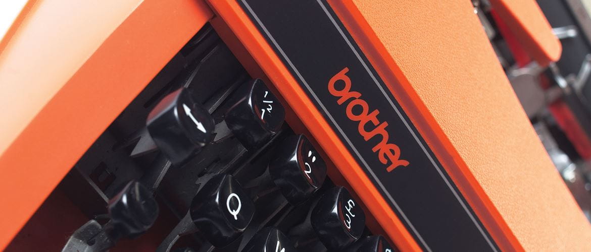 Orange and black Brother typewriter 