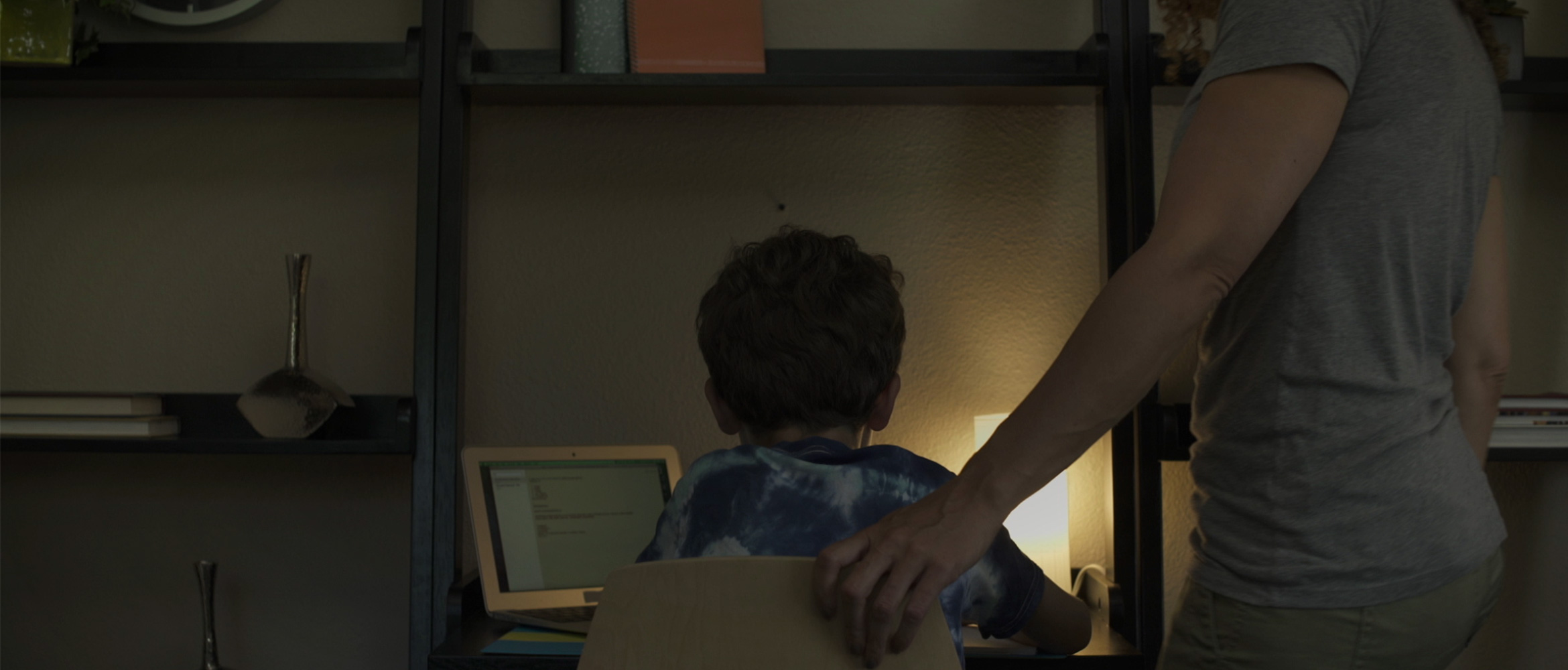 Mum helping son with homework