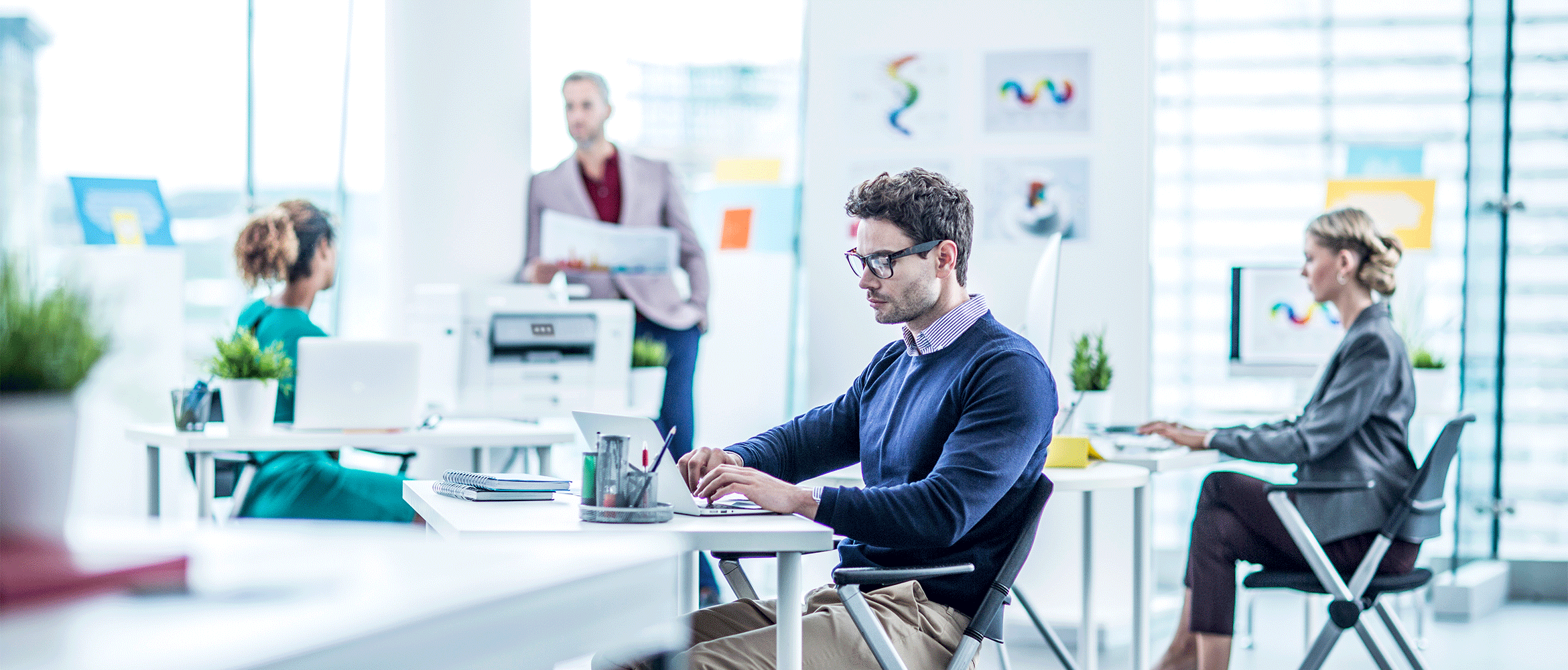 Office environment with Brother inkjet printer in the background