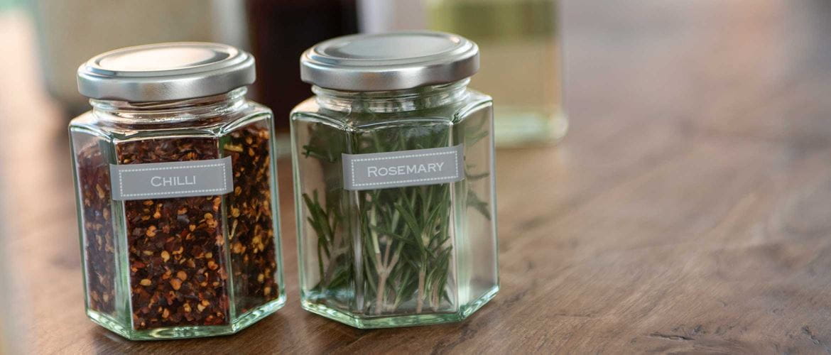 White text on grey labels, applied to jars to identify contents as chilli and rosemary
