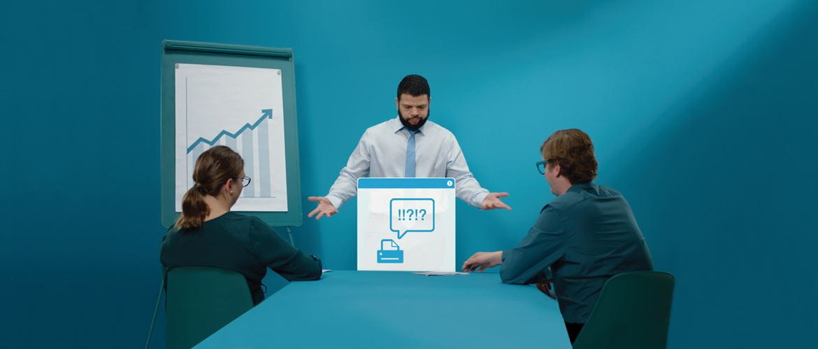 Man stood up doing a presentation to a man and woman