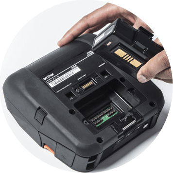 Hand taking battery out of a mobile printer