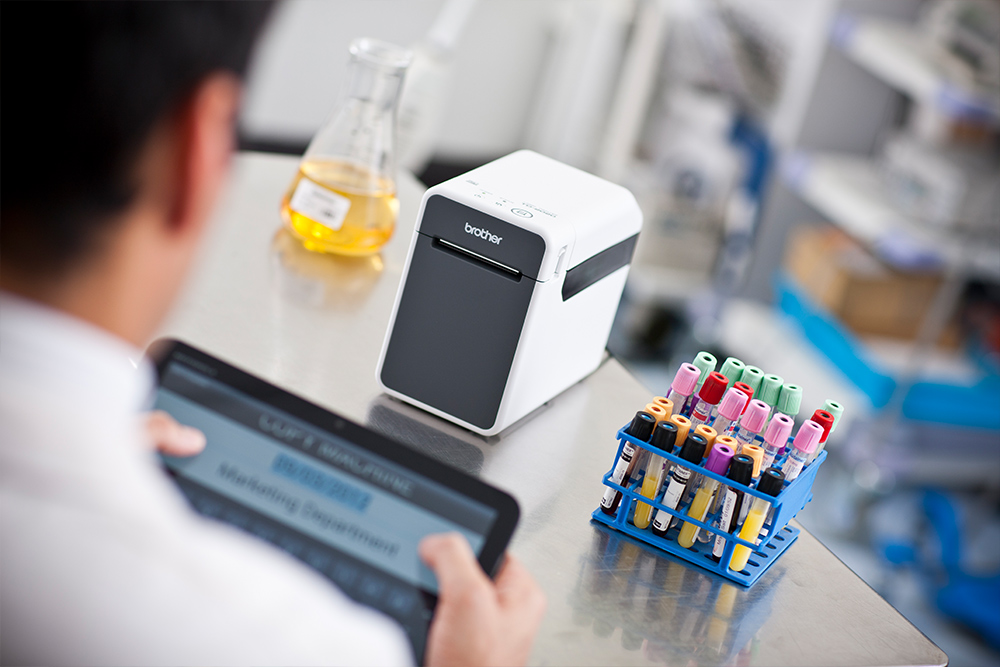 Lab technician labelling samples