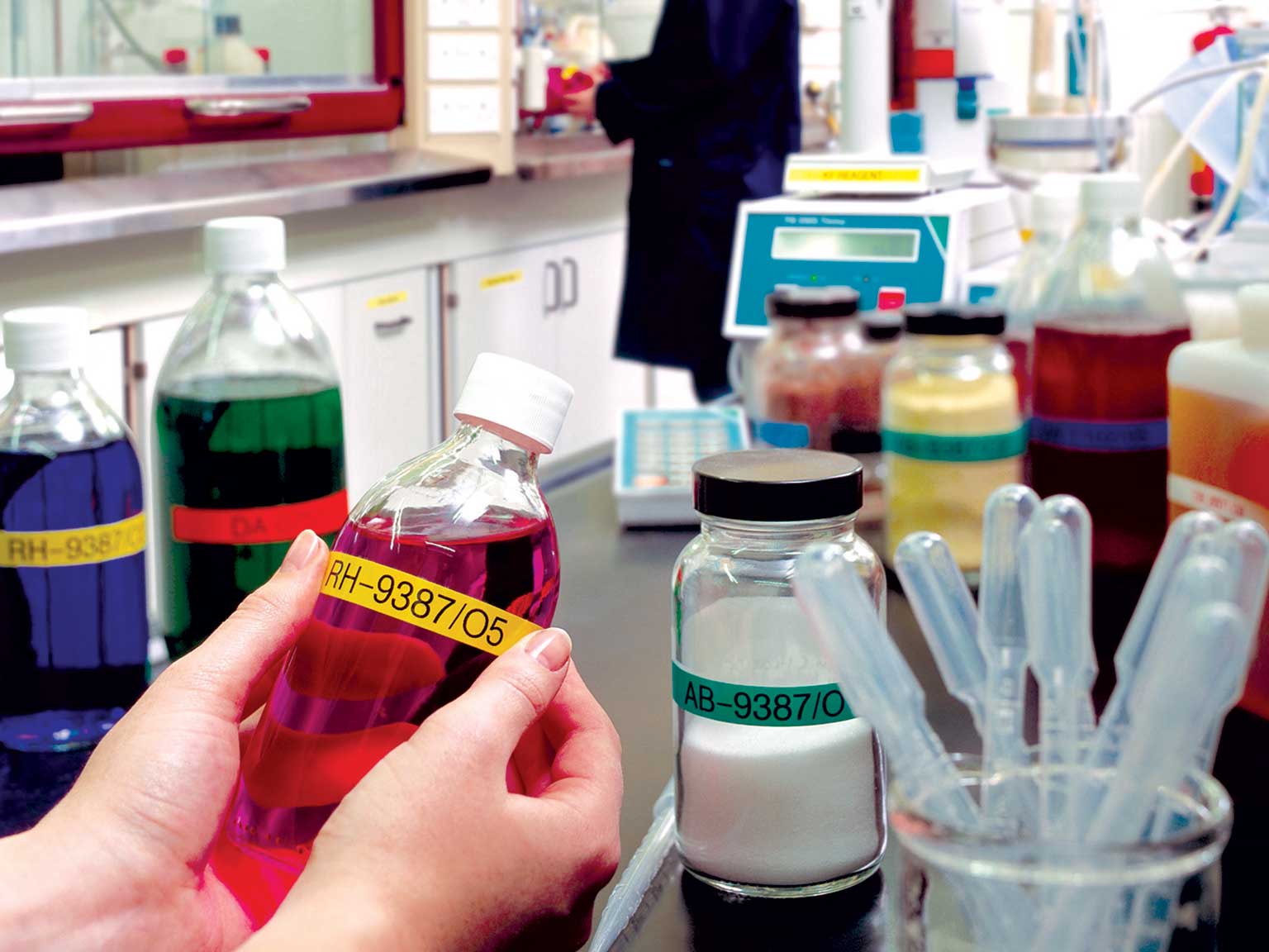 Brother P-touch laminated TZe labels on various chemicals in a laboratory