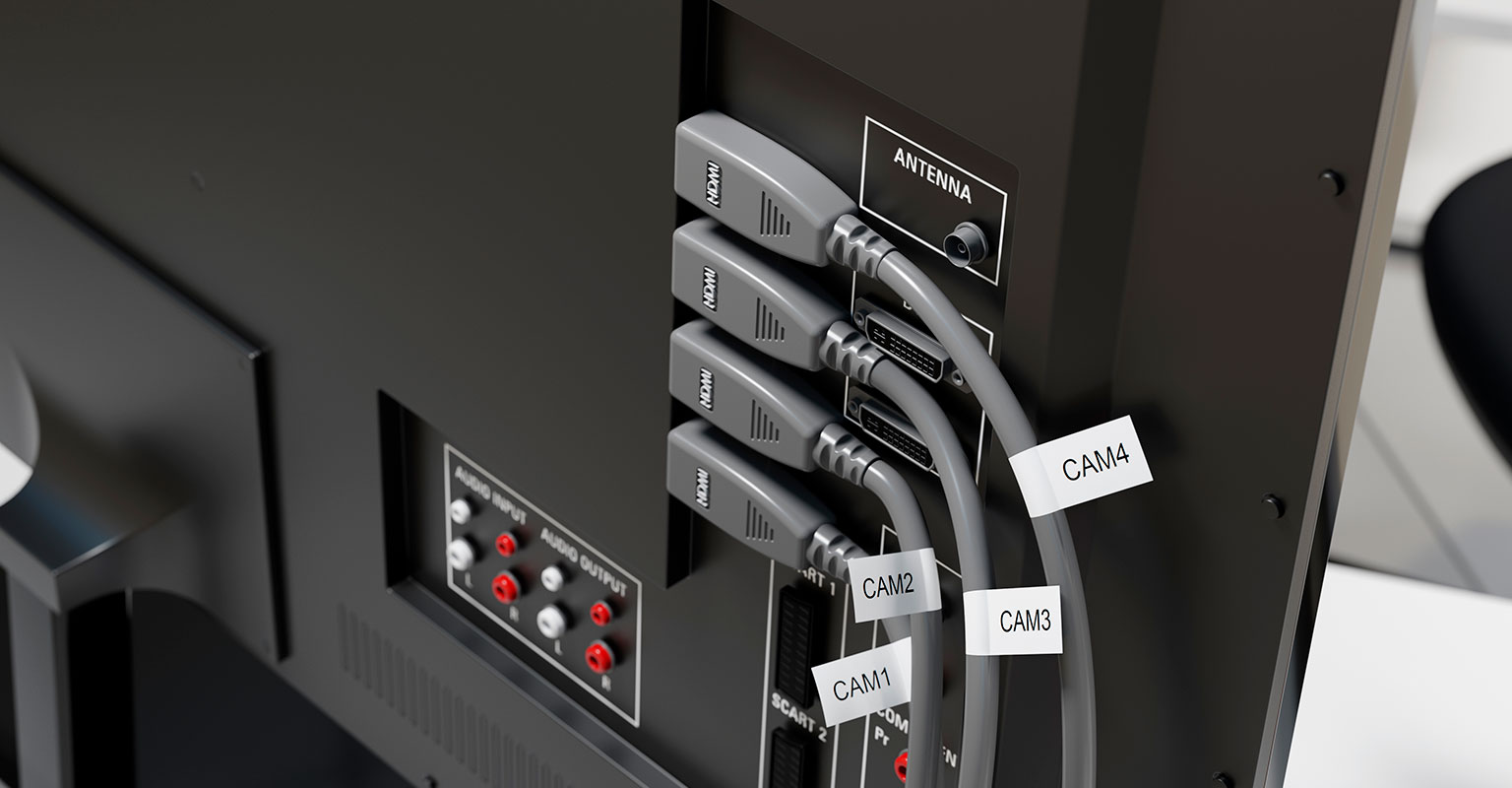 Brother flexible-ID labels wrapped around video HDMI cables going into a monitor