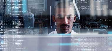 Man in white shirt surrounded by data