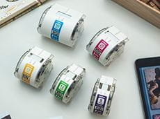Five Brother label cassettes of various widths for the Brother Design and Craft label printer