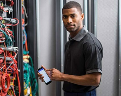 Network technician using Brother iLink&Label app on his smartphone