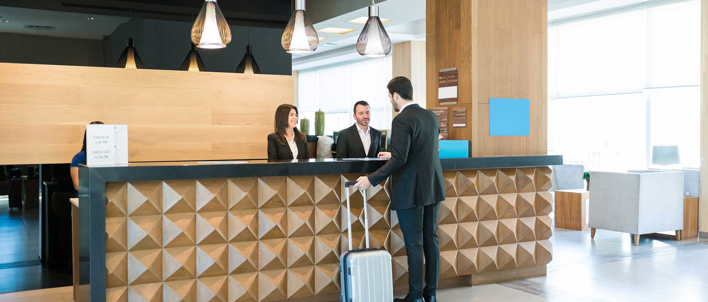 Woman in hotel restaurant or hotel reception , stairs, tables, chairs