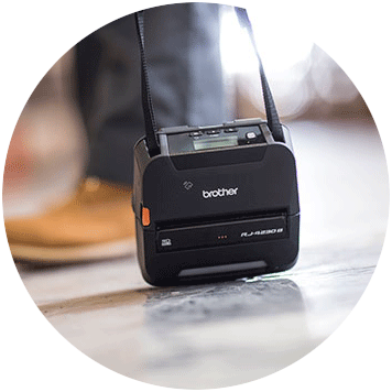 Brother RJ-4 rugged mobile printer dropped on floor with shoulder strap