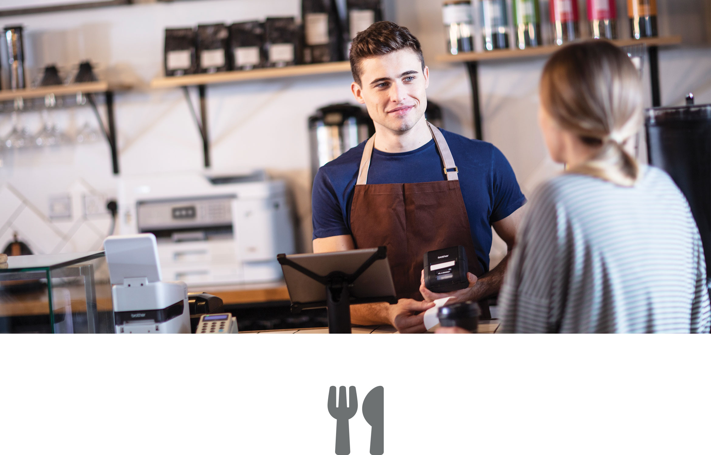 Man in coffee shop serving female customer