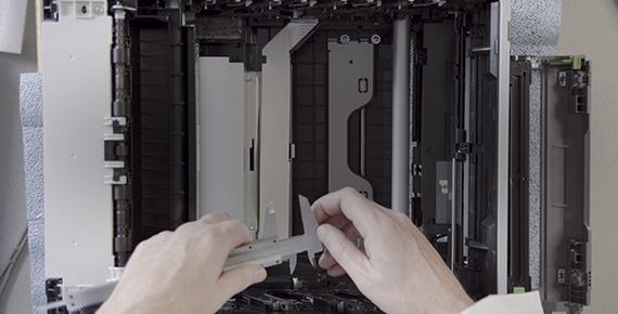 Engineer with printer open