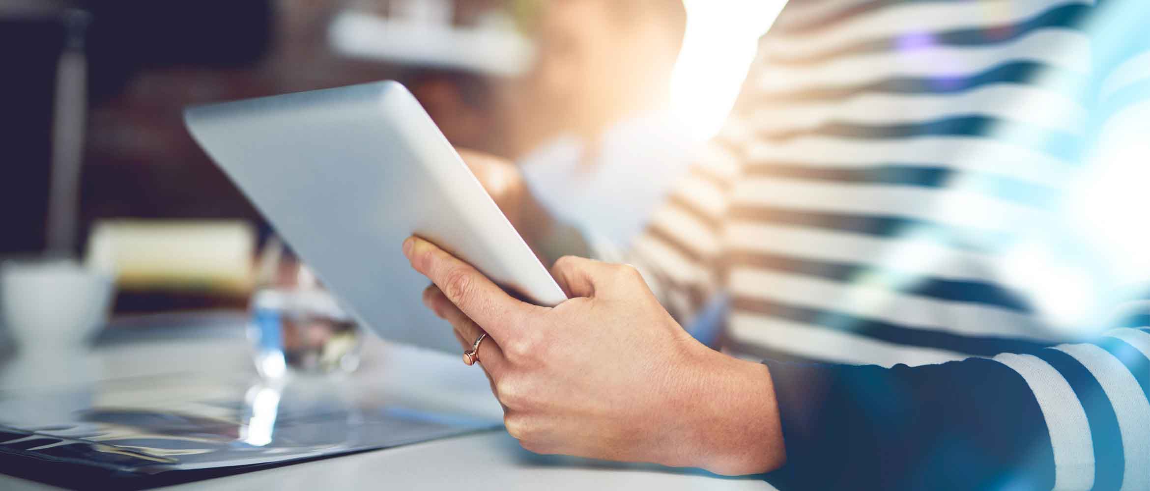 Close up of a lady holding a tablet device