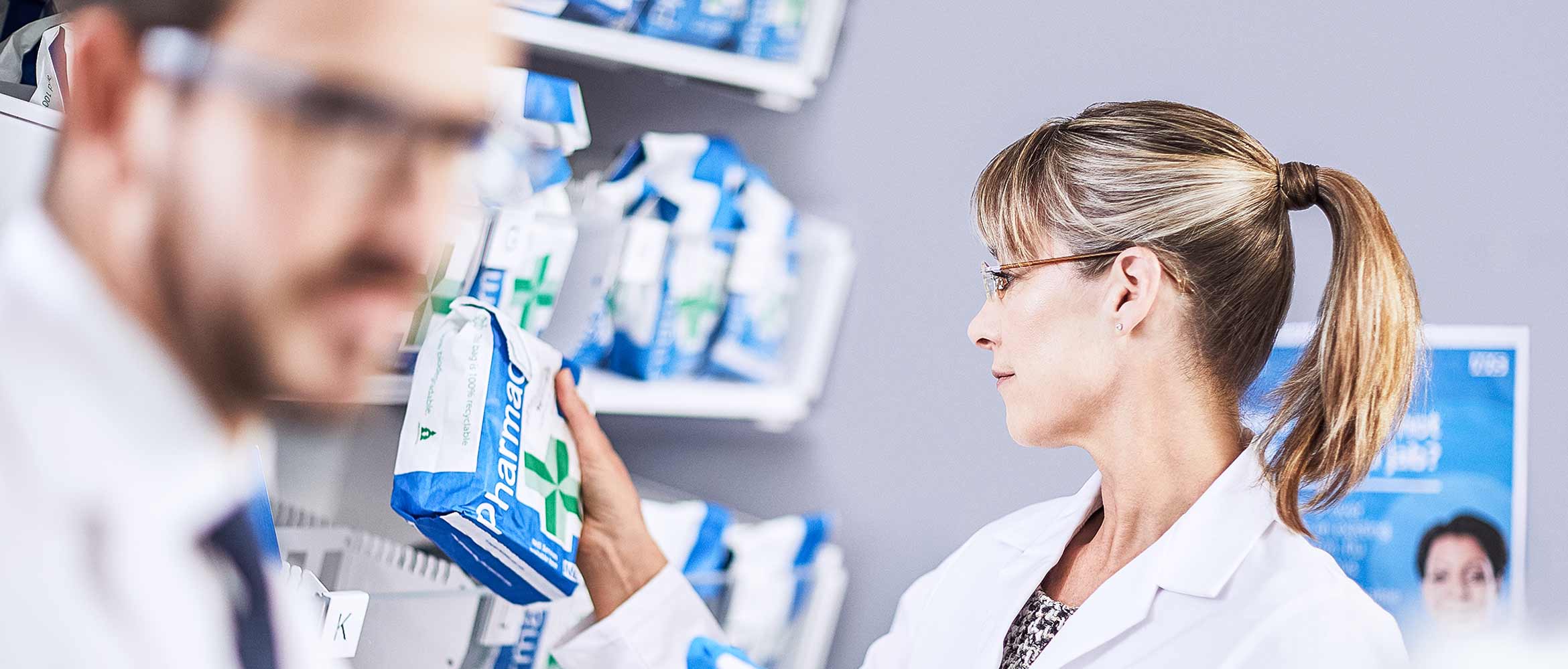 Pharmacist with a labelled prescription