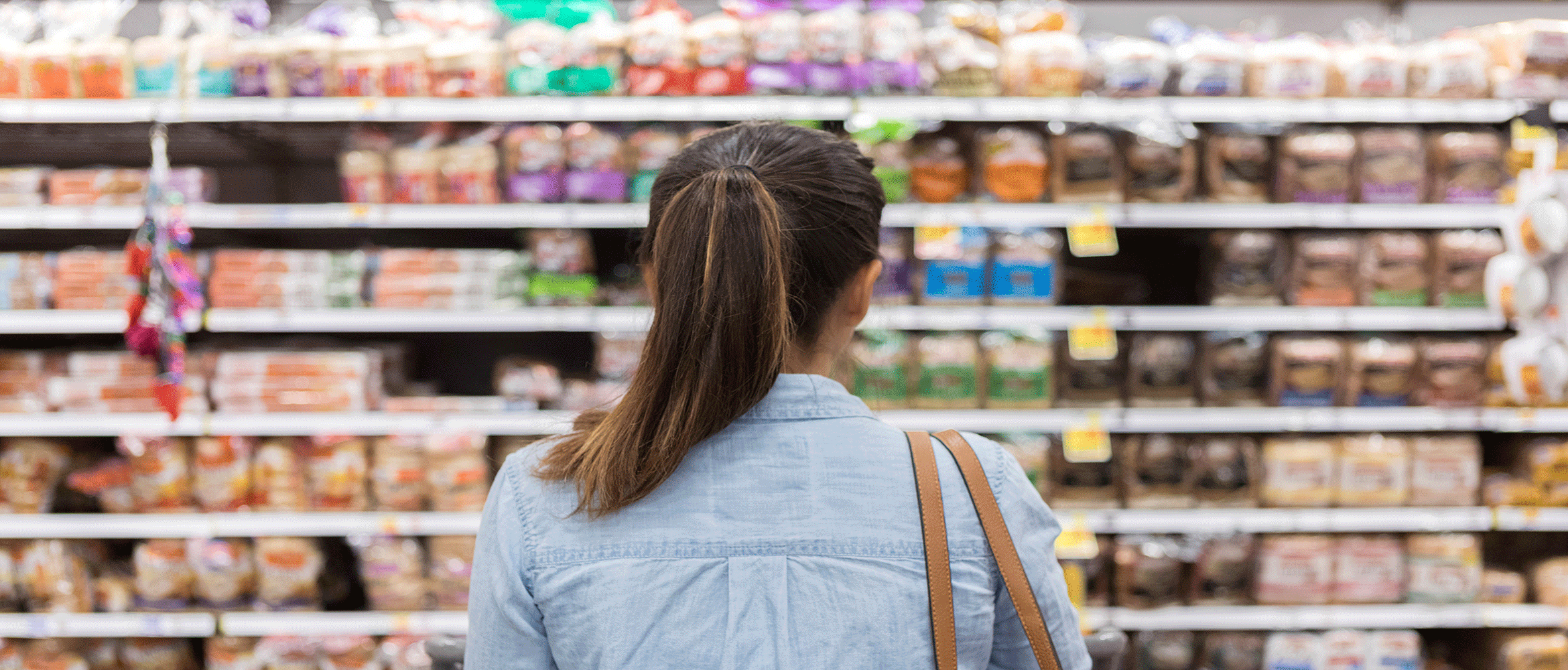 Shopper in the bread aisle at a supermarket