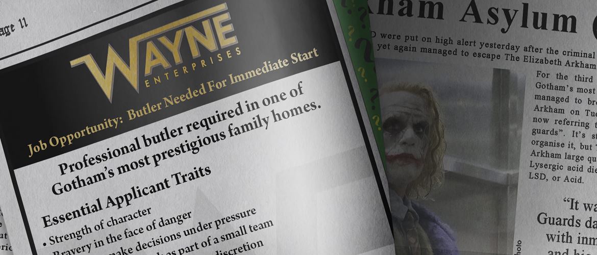 Gotham Globe newspaper opened, showing Wayne Enterprises advertisement for a professional butler and an article about the Joker