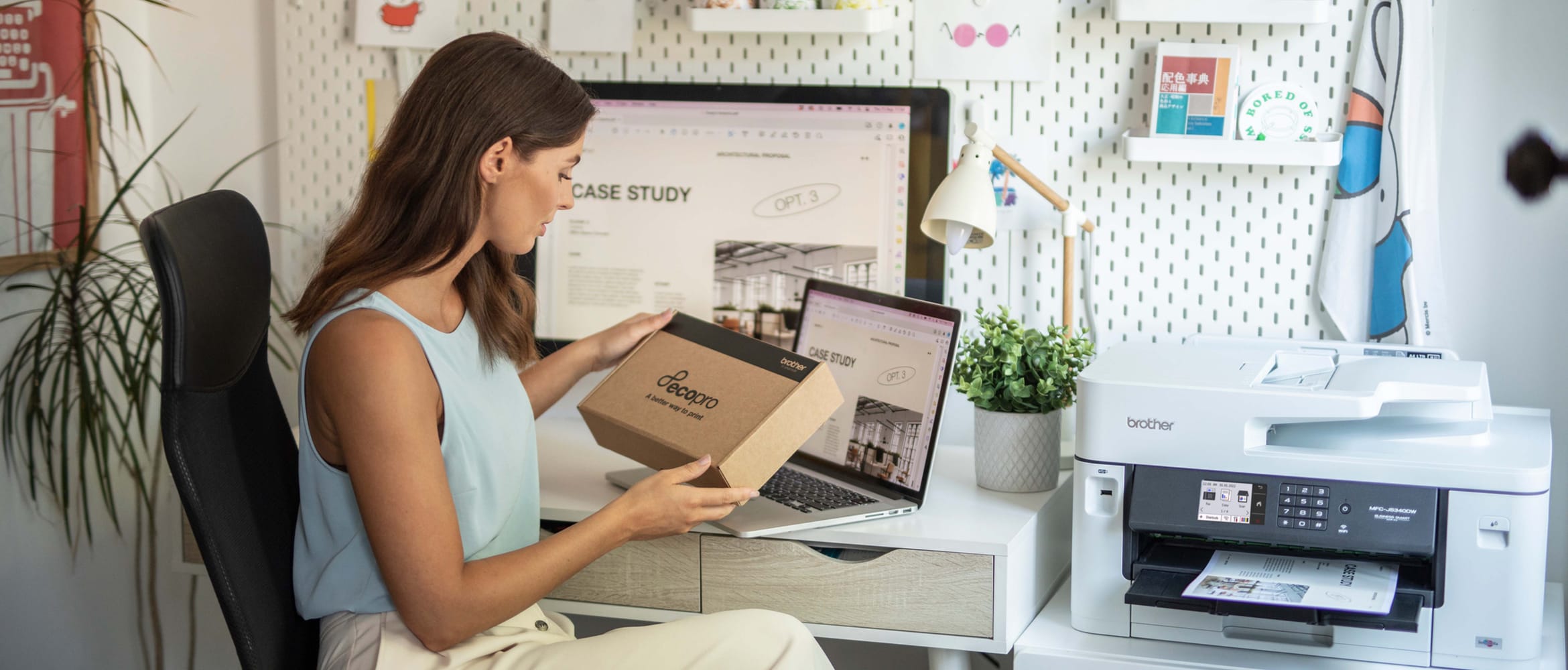 Small business owner opening their ink subscription box