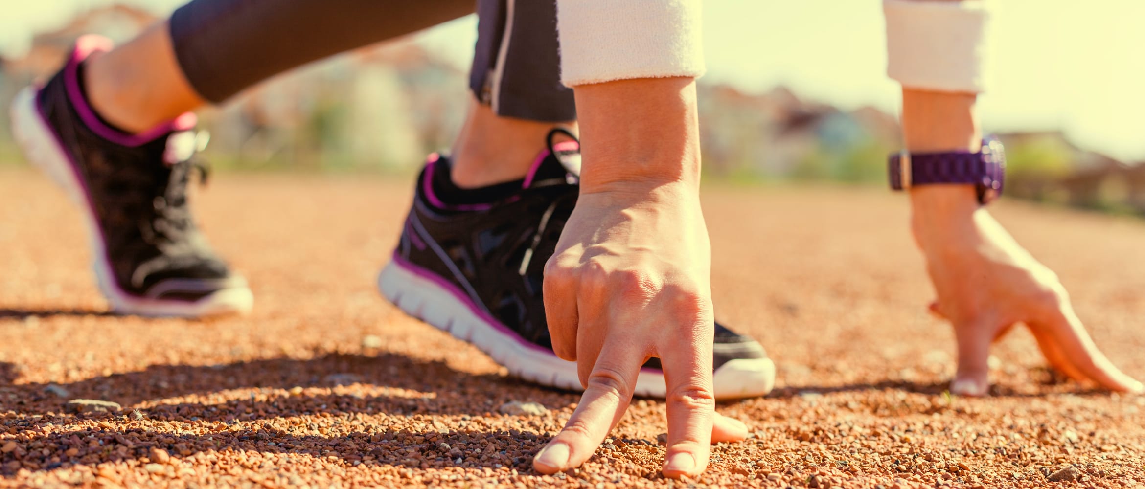 woman on the starting line in a sprint position