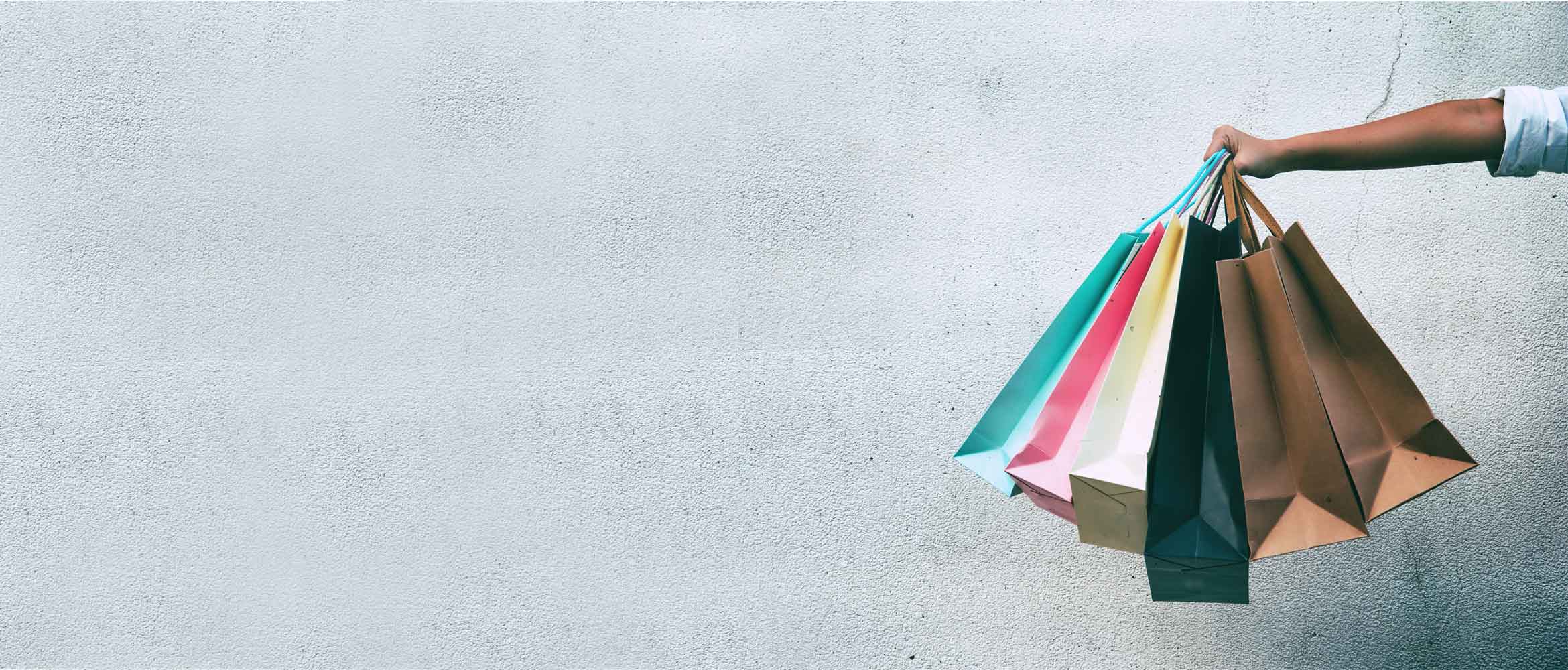 A hang holding lots of shopping bags