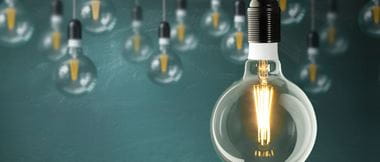 close up of a glowing light bulb to signify good business ideas