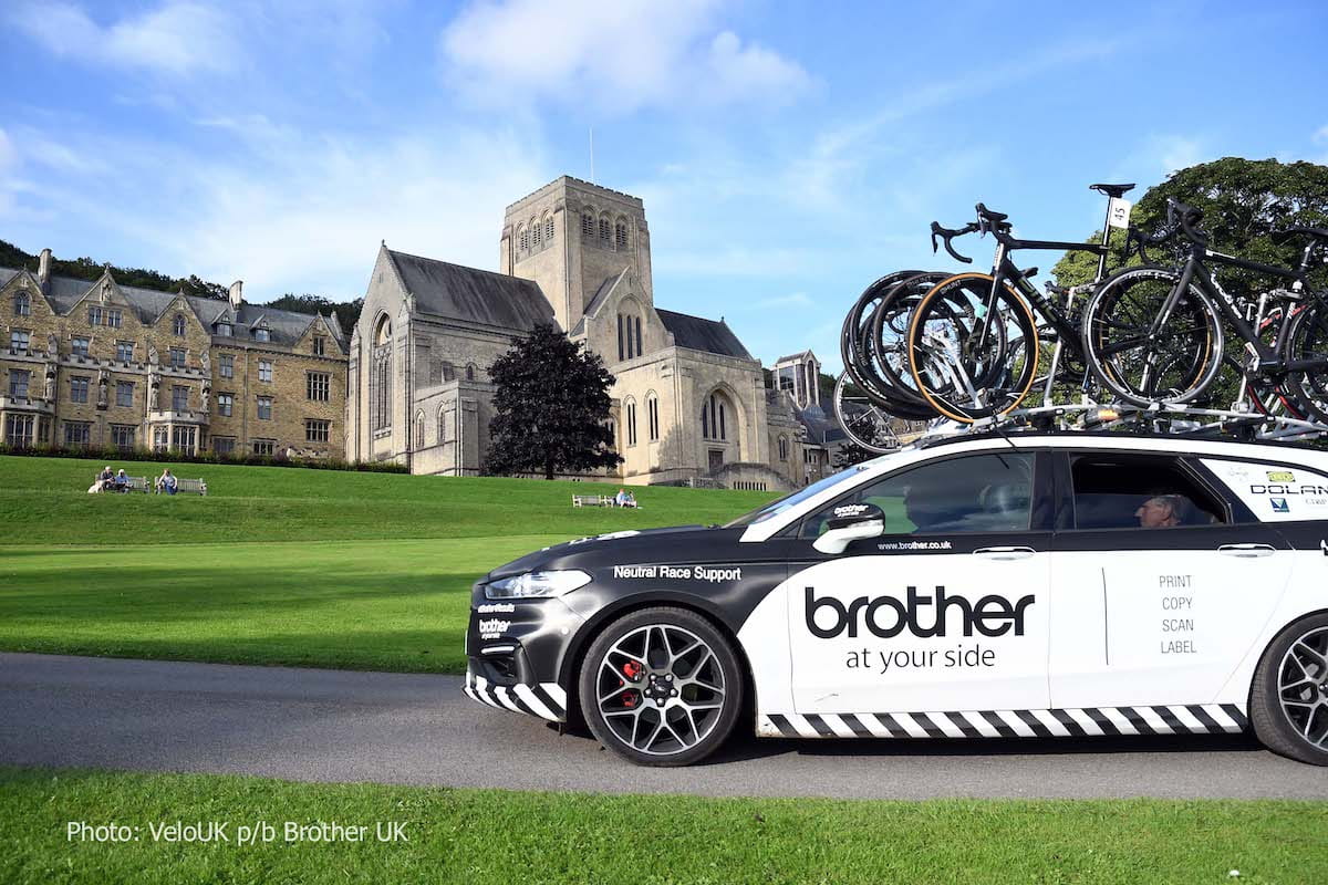 Branded car with bicycles on roof