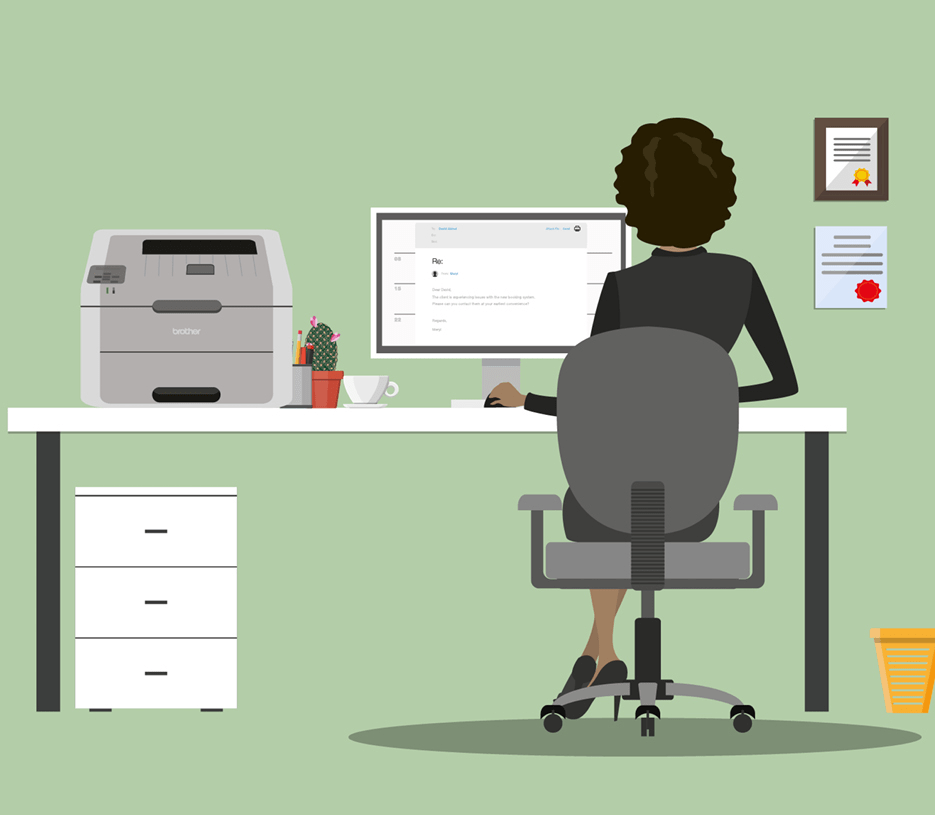woman sat at desk with computer and printer