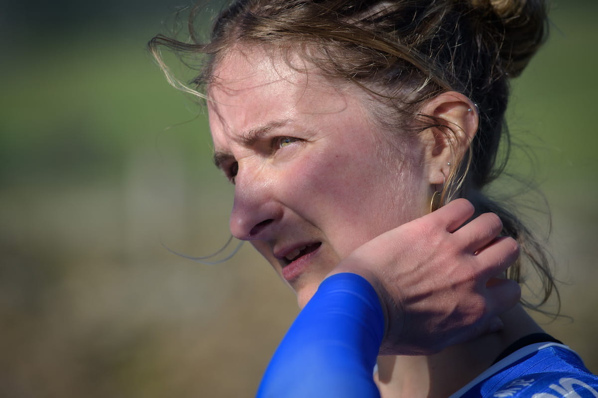 Cyclist Rebecca Richardson rubbing her neck after training for an event