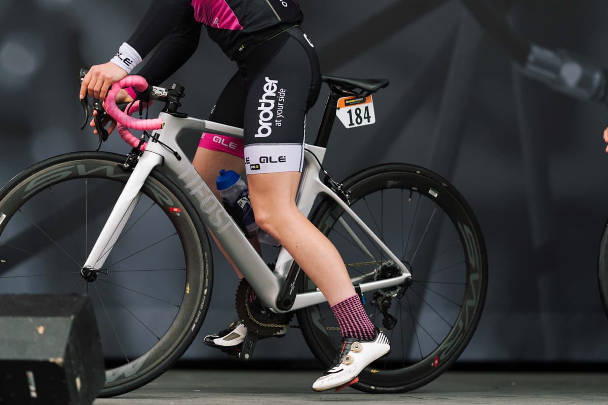Close-up of Brother UK-Tifosi p/b OnForm team cyclist straddling a bike