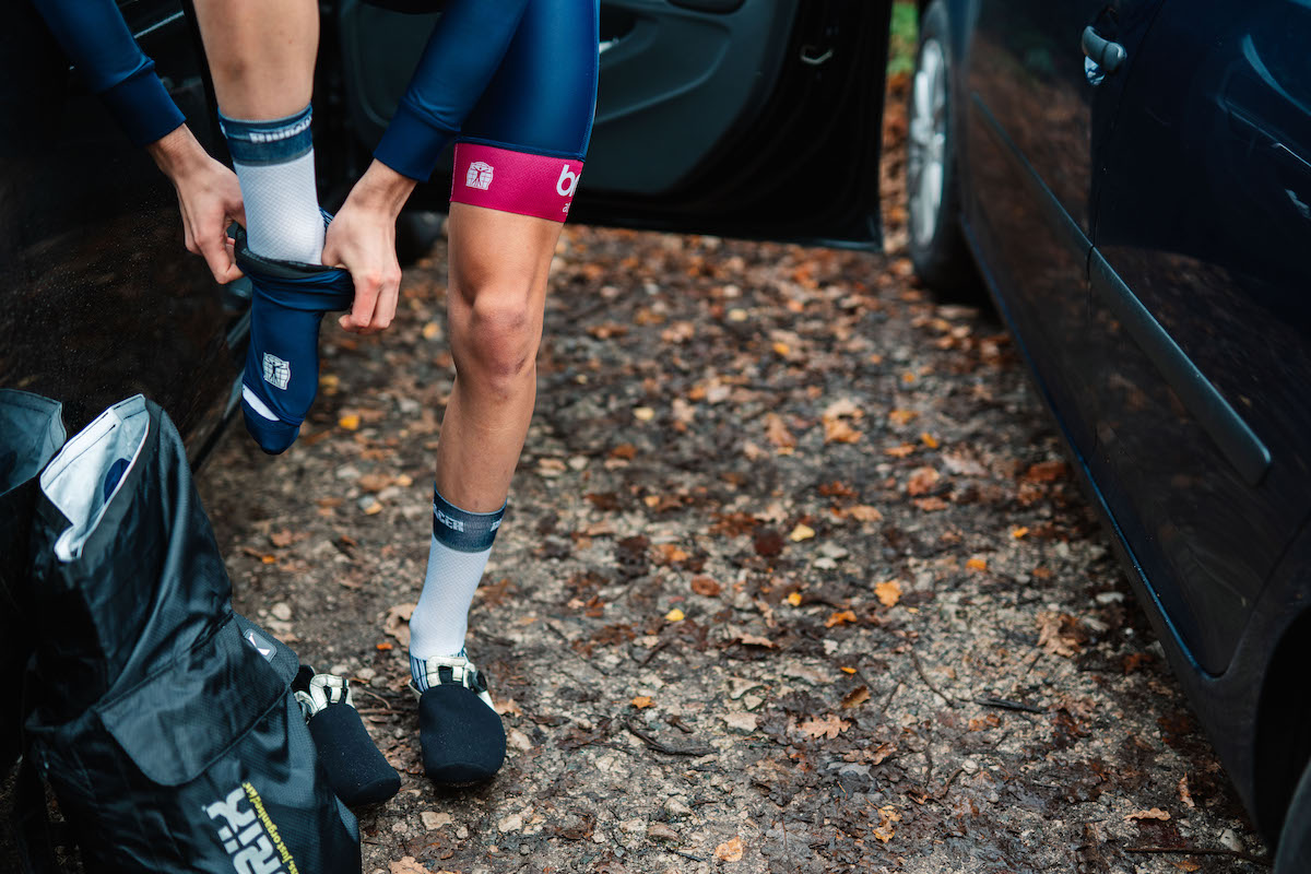 Cyclist putting his socks on