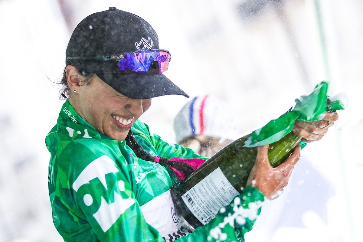 women's tour stage cycling winner celebrates with champagne