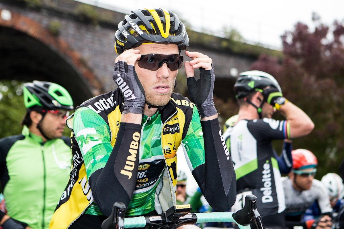 cyclist adjusts glasses ahead of the start of the race