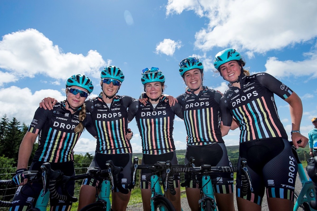 Team Drops pose on bikes before the race