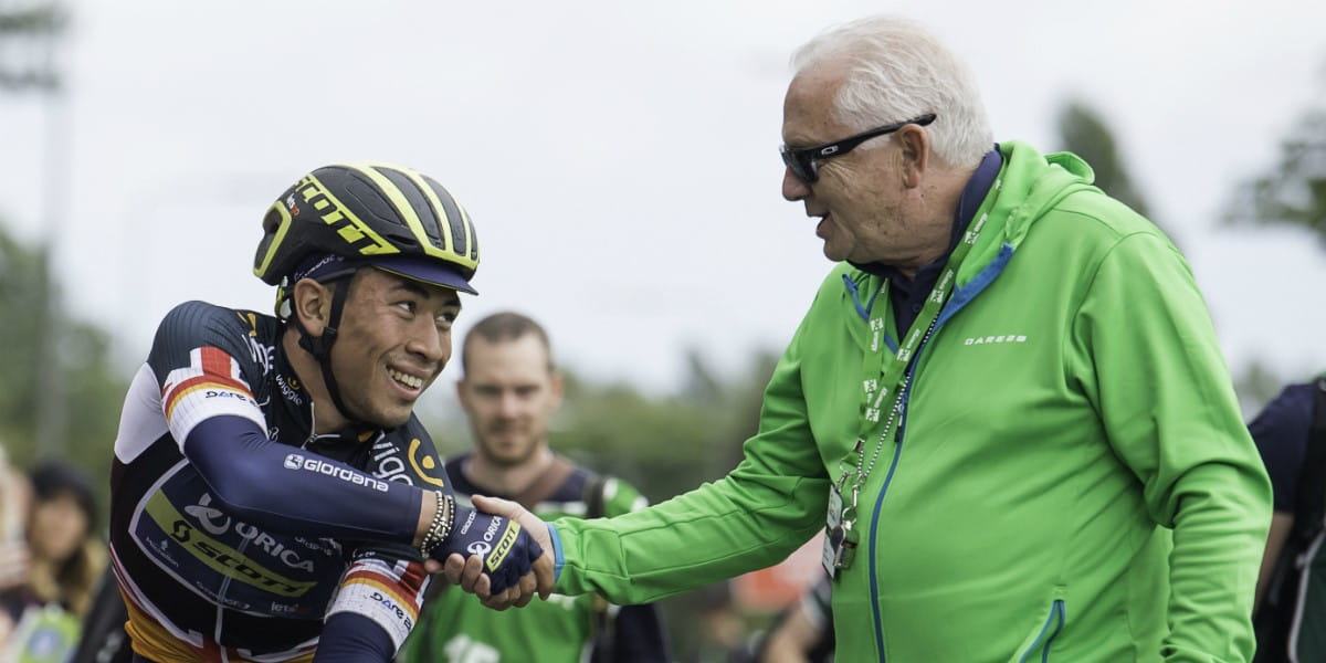 cycling winner shakes hands