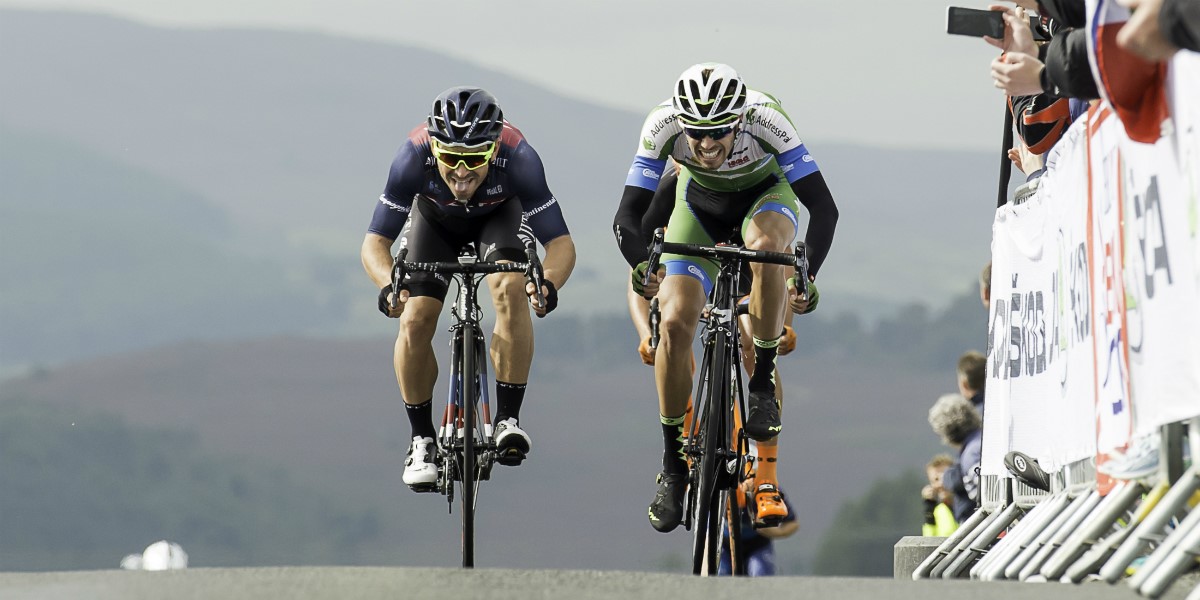 cyclists battling it out at the top of a climb