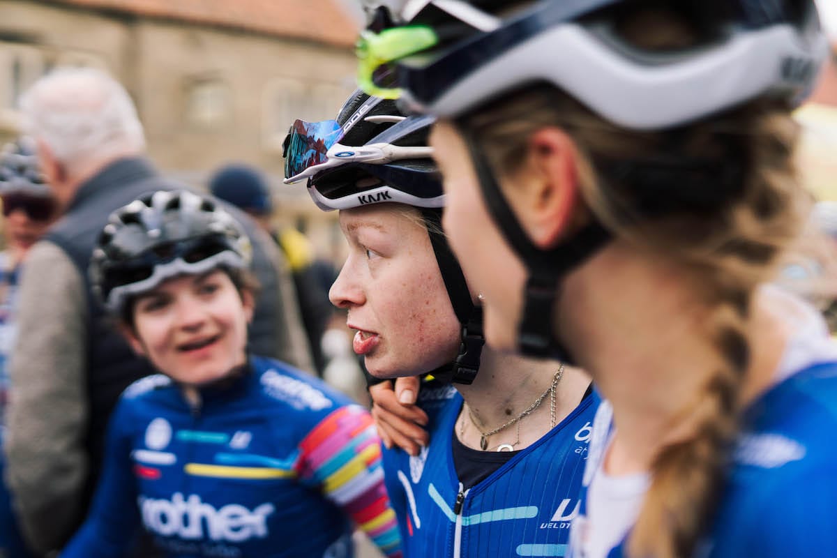 Cyclist Molly Patch talking to team mates