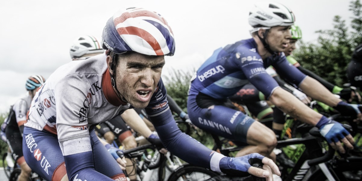 cyclist grits his teeth mid-way through the race