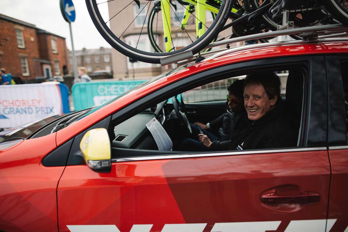Two people sat in a Vitus Pro team car