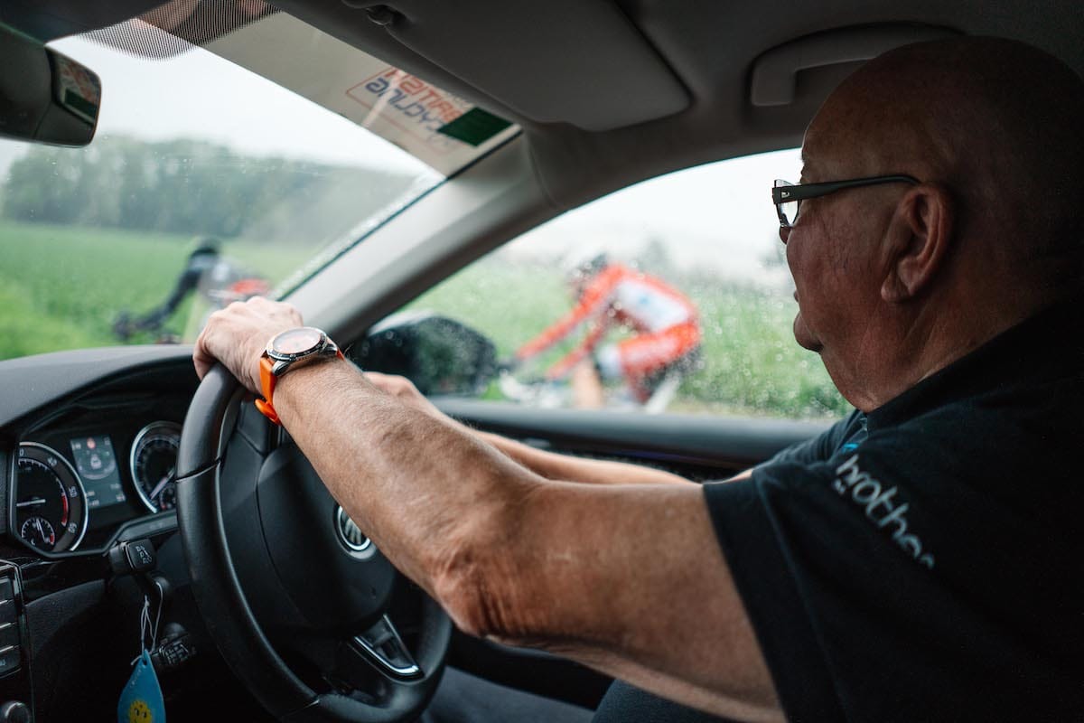 Tony Barry driving in a car alongside cyclists