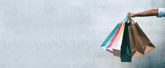 A hang holding lots of shopping bags