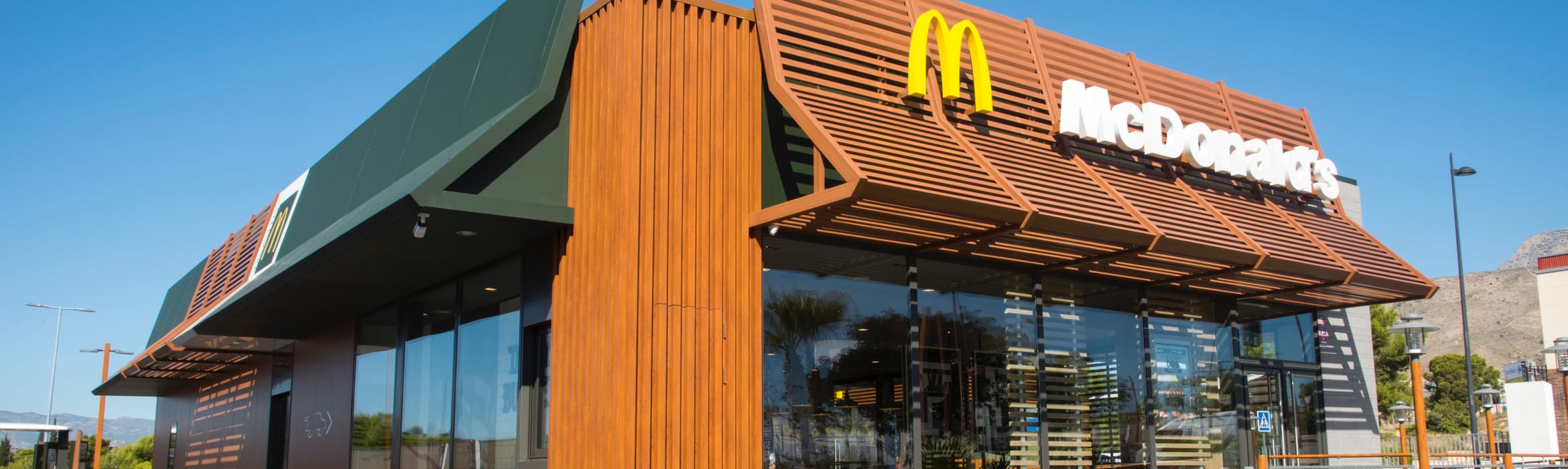 Exterior view of a McDonald's restaurant on a sunny day in Spain