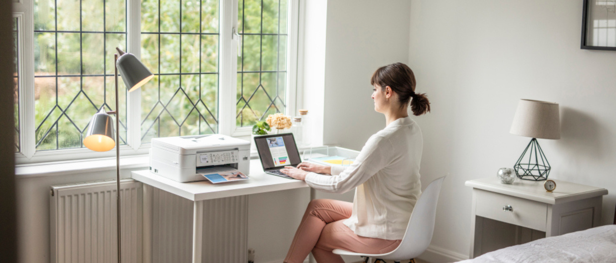 man at home scanning documents using a brother device
