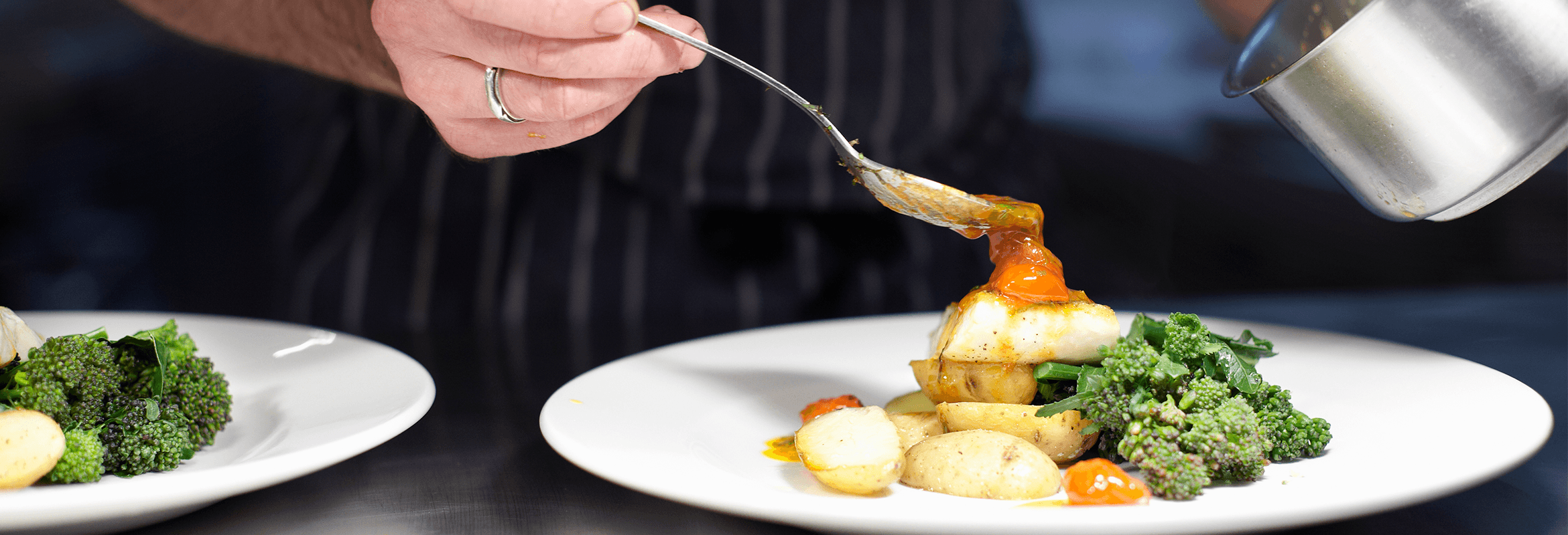 chef serving a plate of food