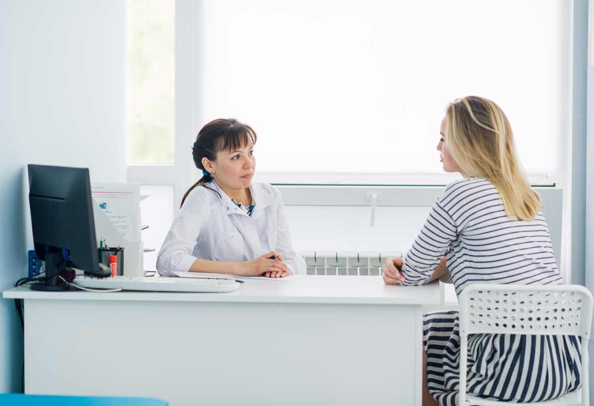 Doctor chatting to a patient