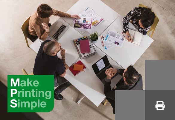 An overhead view of four work colleagues sat around a cluster of square white desks, the slogan 'Make Printing Simple' on a green background is in the bottom left corner