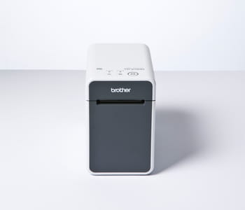Front view of Brother TD-2130N industrial label printer on white surface and background