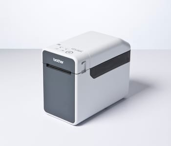 3/4 view of Brother TD-2130N label printer on white surface and background