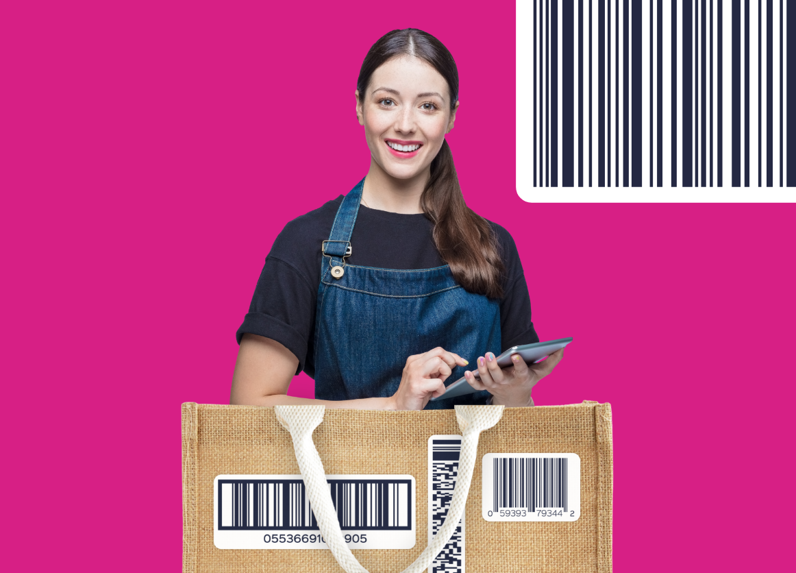 A female retail grocery worker holding a tablet device with a shopping bag in front on a crimson background